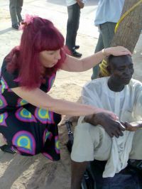 Linnie prays for the leper.