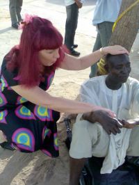 Linnie prays for the leper.